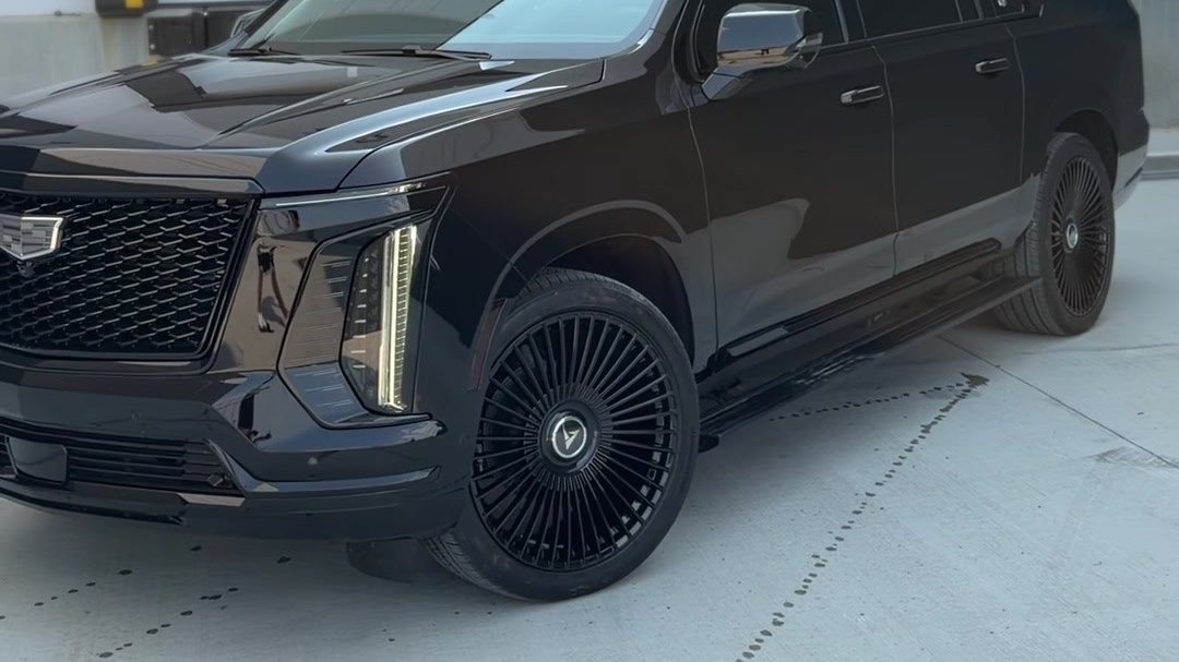 Cadillac Escalade fitted with 24-inch gloss black alloy wheels in Edmonton