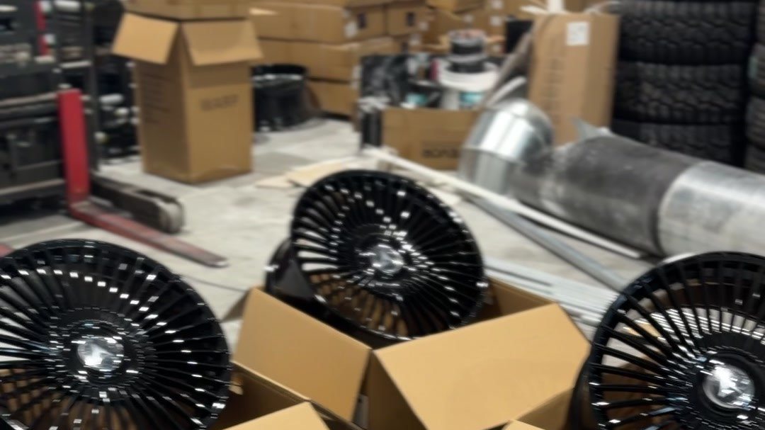Alloy wheels and tires on the First Auto Nation warehouse floor, Edmonton