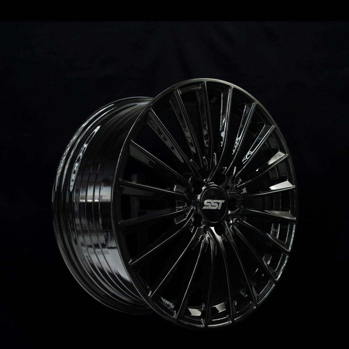 SST 1 gloss black alloy wheel at a three-quarter angle showing spoke depth