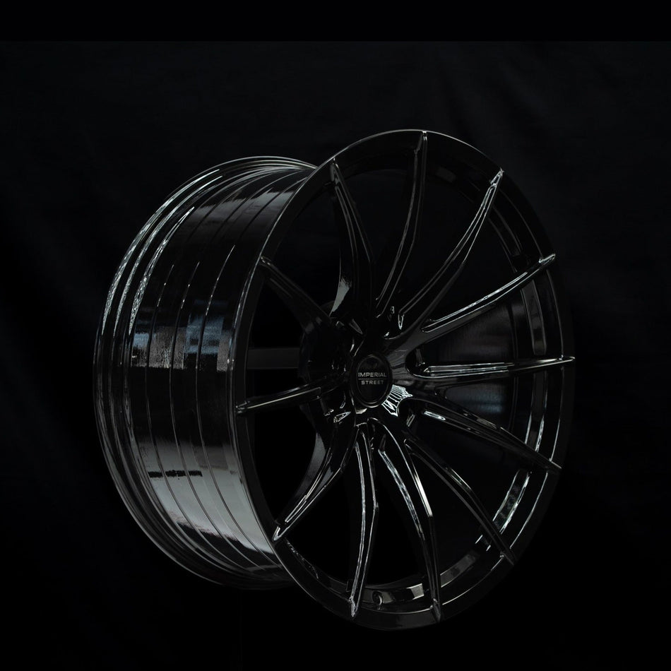 Imperial Street Series 4 gloss black alloy wheel at a three-quarter angle showing spoke depth