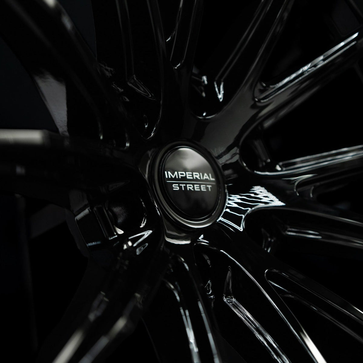 Imperial Street Series 4 gloss black alloy wheel, close-up of the spoke and rim edge finish