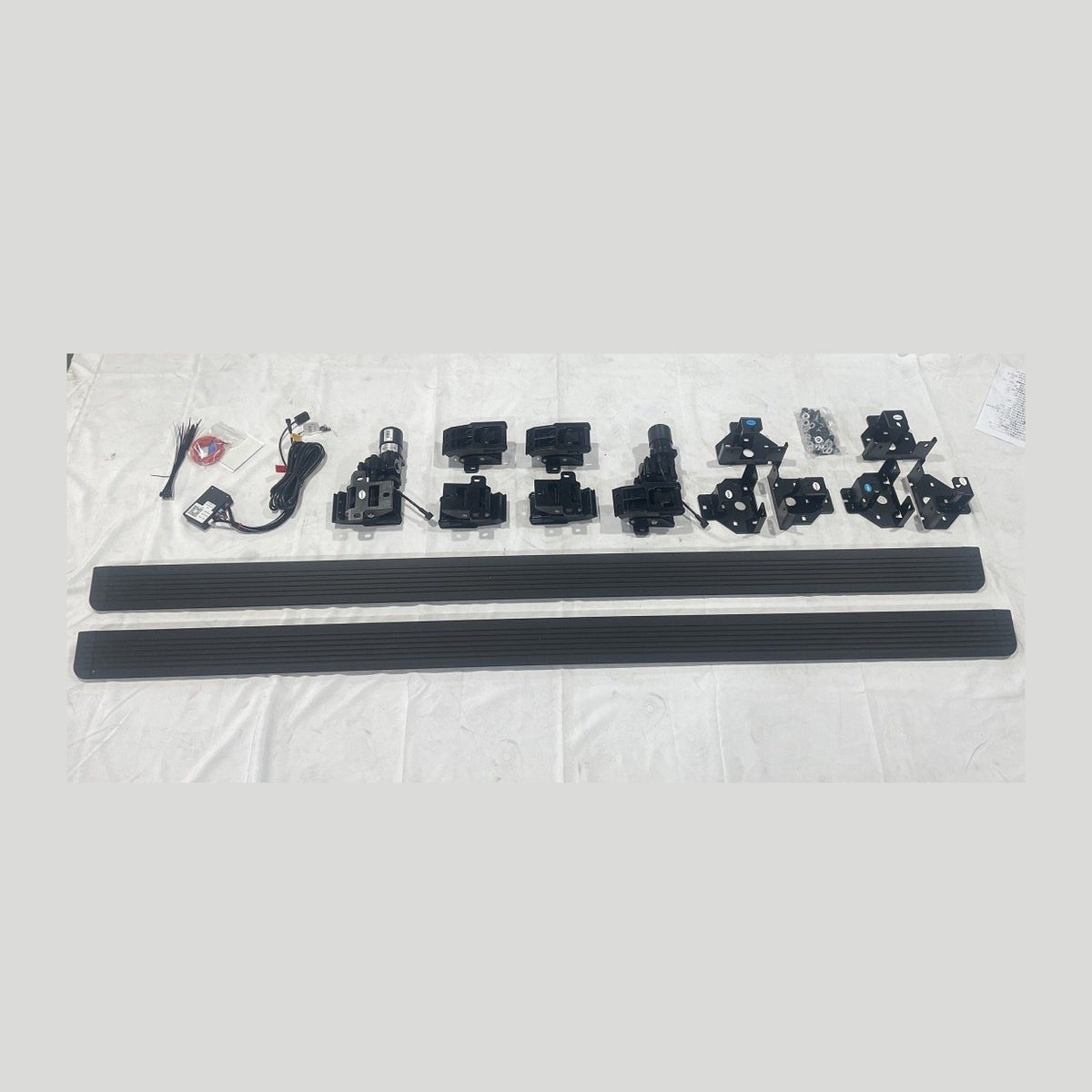 Sentinel electric side steps — full kit contents laid out