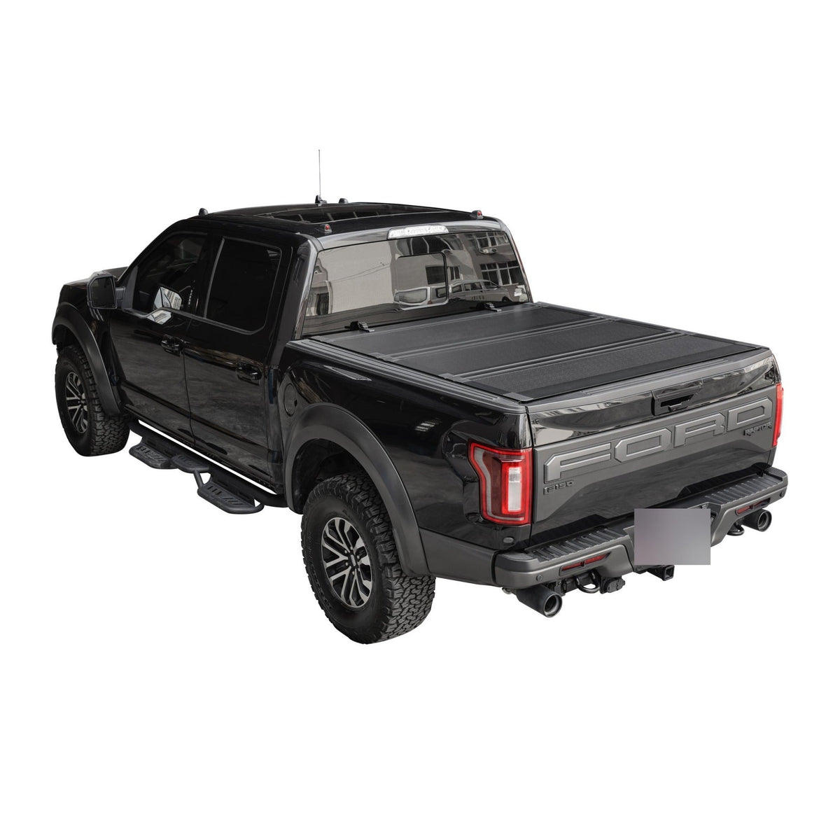 Titan Hard Flip-Back tonneau cover closed on a black pickup truck bed