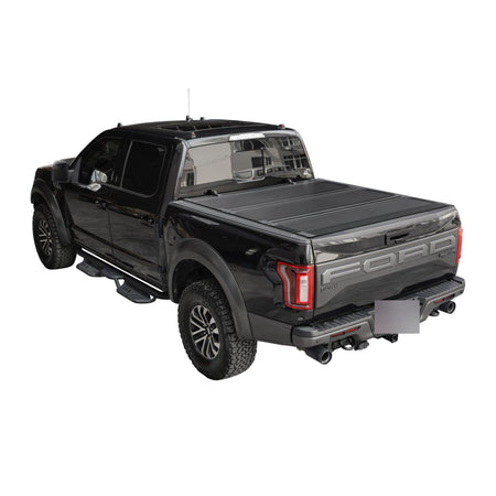 Titan Hard Flip-Back tonneau cover closed on a black pickup truck bed