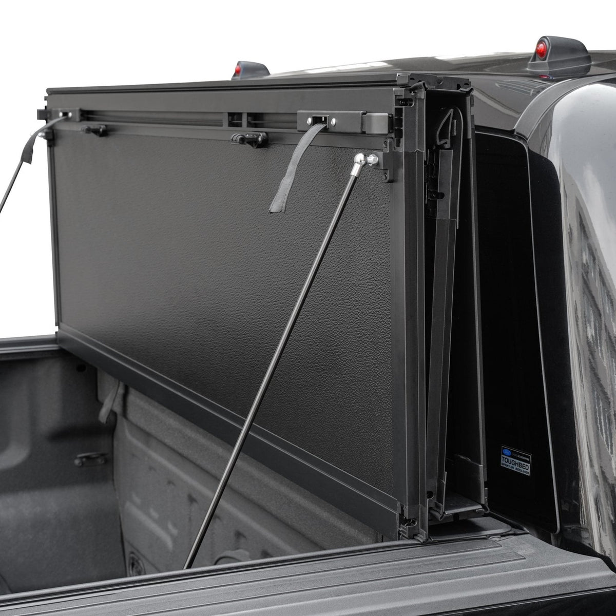 Titan Hard Flip-Back tonneau cover flipped up and held by its gas struts