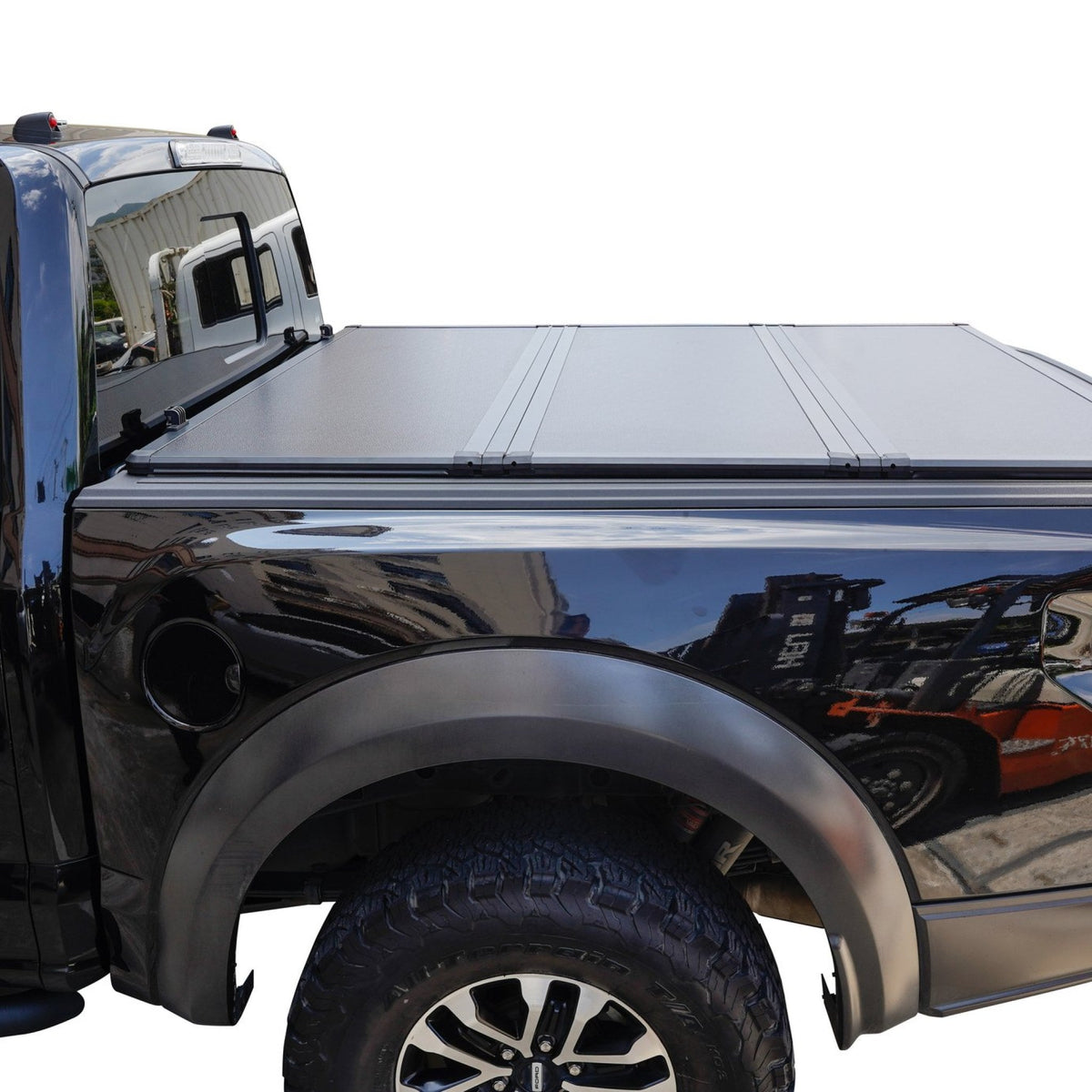 Titan Hard Tri-Fold tonneau cover closed on a black pickup truck bed