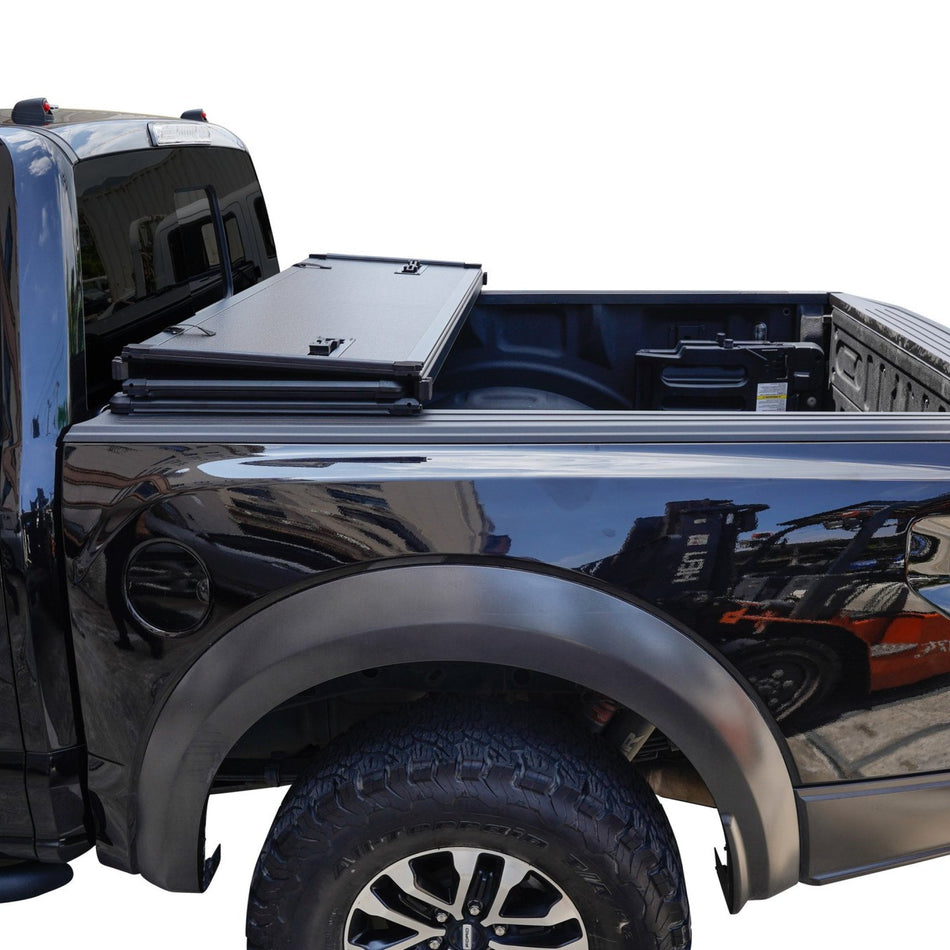 Titan Hard Tri-Fold tonneau cover partially folded on the truck bed