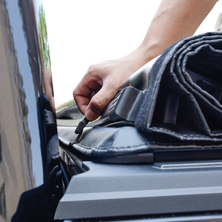 Titan Soft Roll-Up tonneau cover rolled up at the cab end, close-up