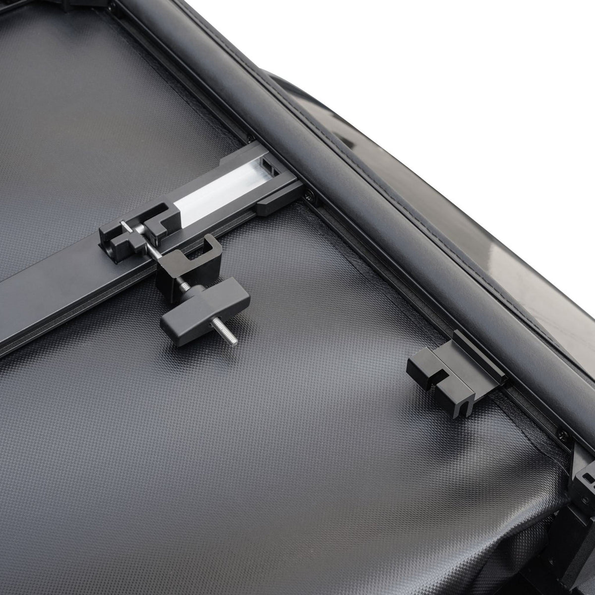 Titan Soft Tri-Fold tonneau cover, close-up of the bed-rail clamp