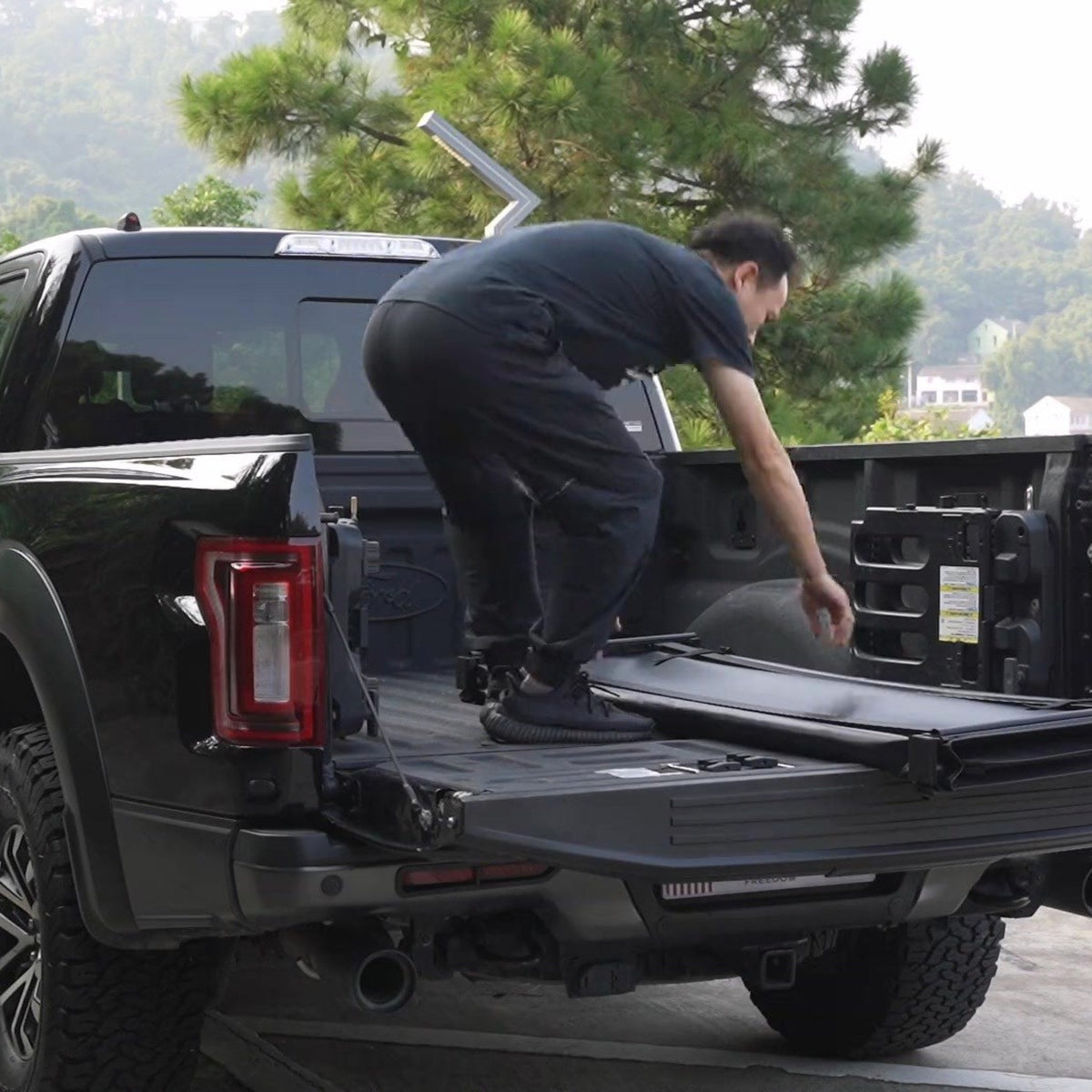 Loading the bed of a pickup fitted with a titan Soft Tri-Fold tonneau cover