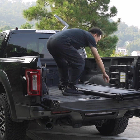 Loading the bed of a pickup fitted with a titan Soft Tri-Fold tonneau cover